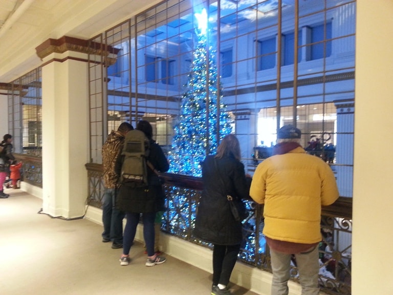 The Walnut Room at Christmas tree crowd 8th floor looking down